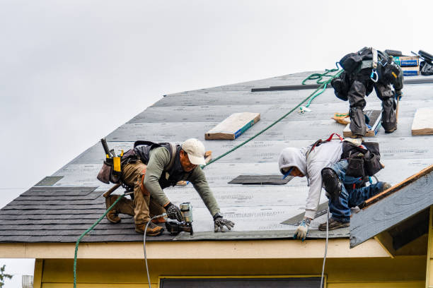 Professional Gutter Installation technician working in Conway, MA